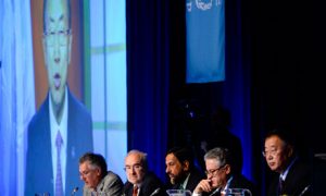 Ban Ki-moon, the UN secretary general, addresses the United Nation's Intergovernmental Panel on Climate Change via video link. 'The heat is on. Now we must act,' he said. Photograph: Jonathan Nackstrand/AFP/Getty Images